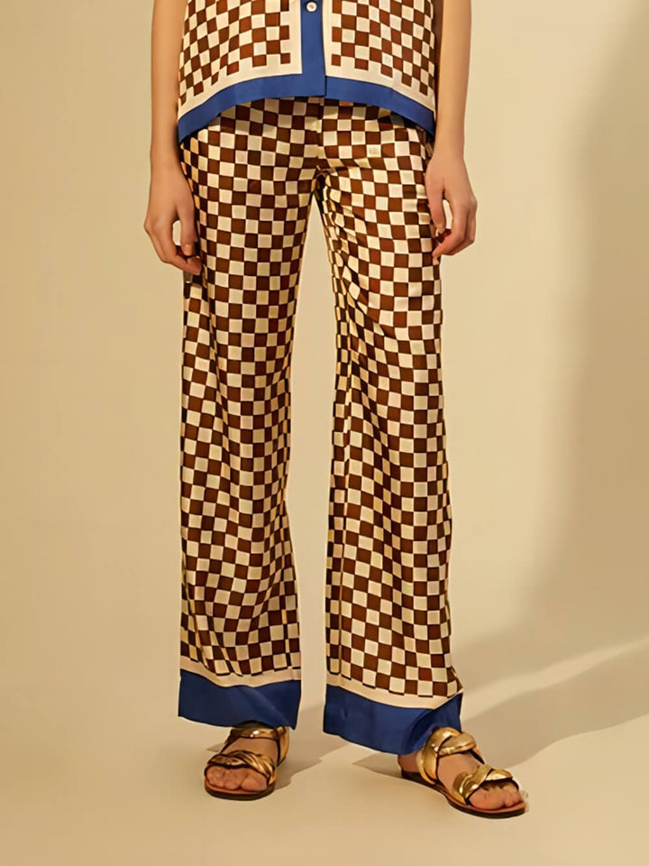 Pantalones elásticos sueltos con empalme de rayas azules con estampado de tablero de ajedrez único