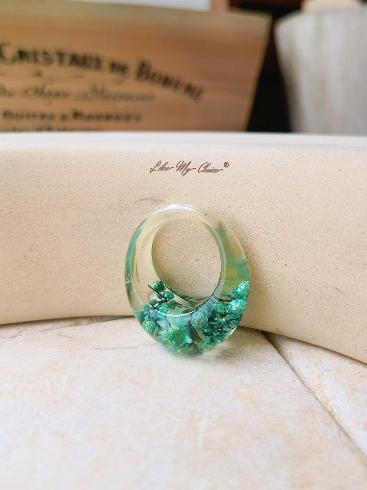 Dried flower resin ring with green flowers