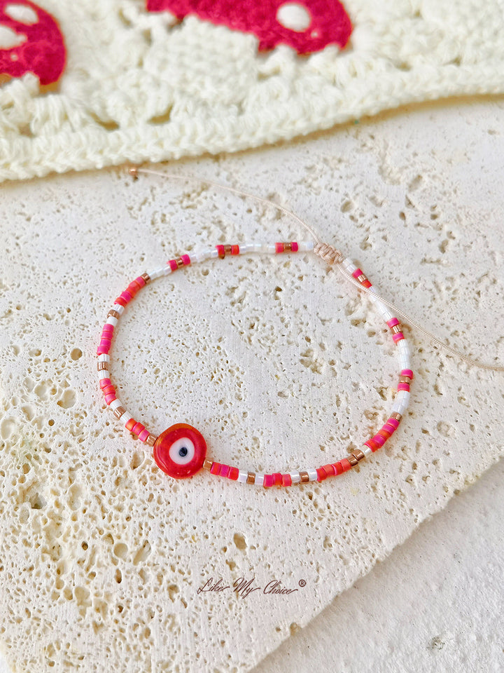 Verstellbares Perlenarmband mit Kordelzug, rotes Auge