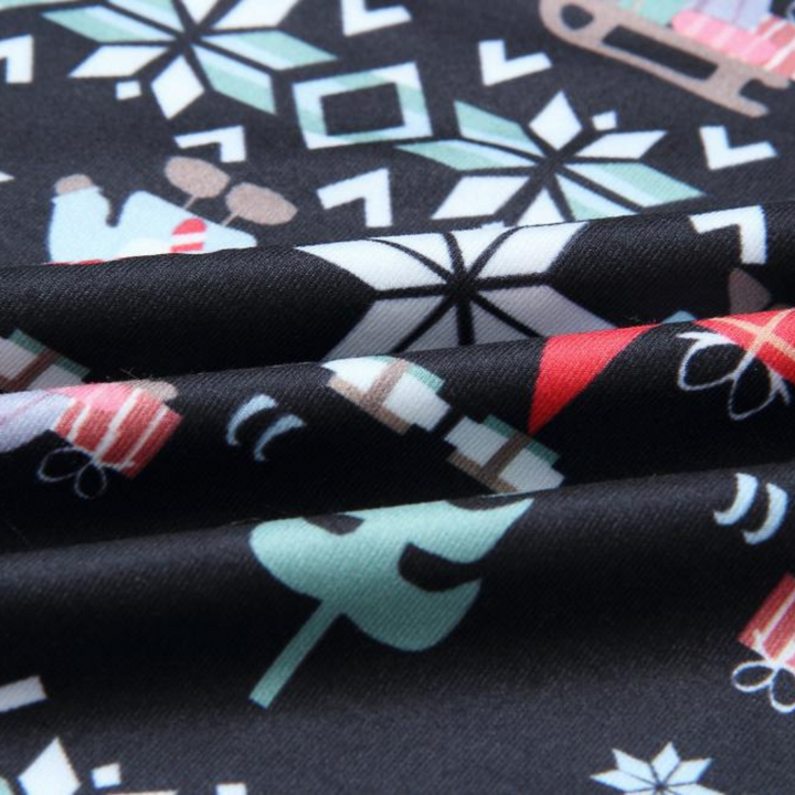 Suloiset joulupukki- ja lumihiutalekuvioiset pyjamasetit