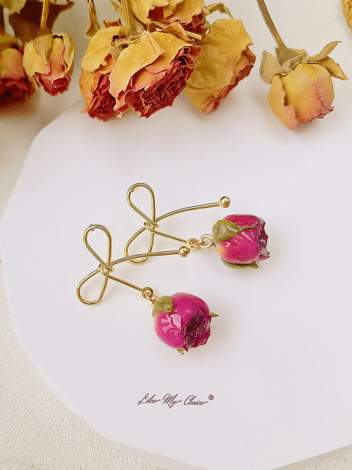 Σκουλαρίκια με ροζ φιόγκο αποξηραμένα λουλούδια